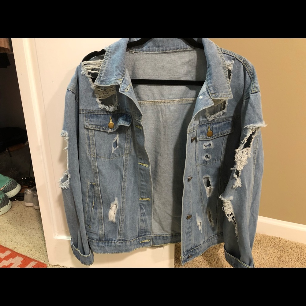 Ripped oversized jean jacket. Size medium/large.